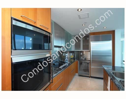 Kitchen with over-sized fridge and stainless steel appliances