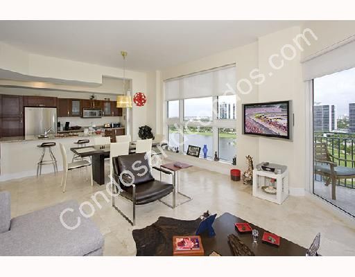 Living room and kitchen with golf & cityscape views