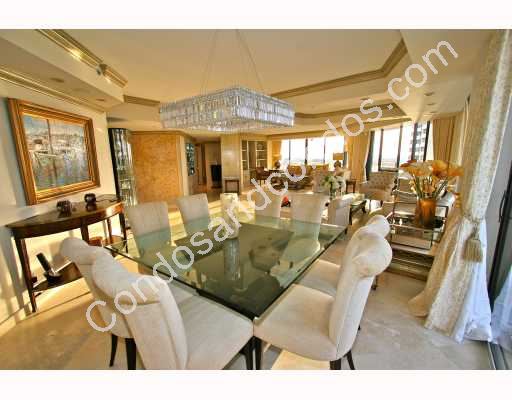 Lavish formal dining area with recessed ceilings