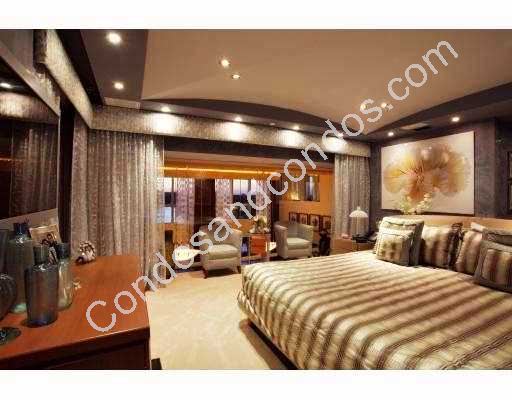 Plush master bedroom with stylish drapery and seating