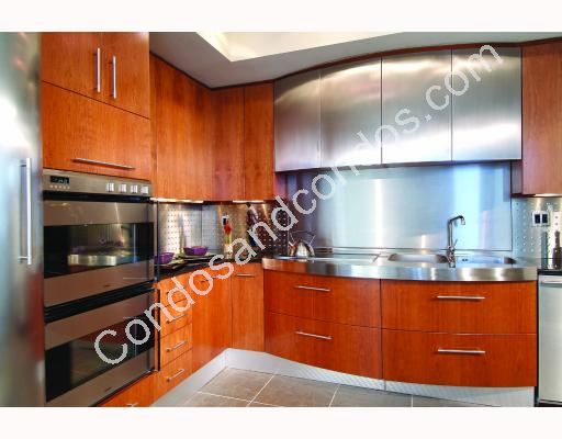 Spacious gourmet kitchen contains stainless steal appliances