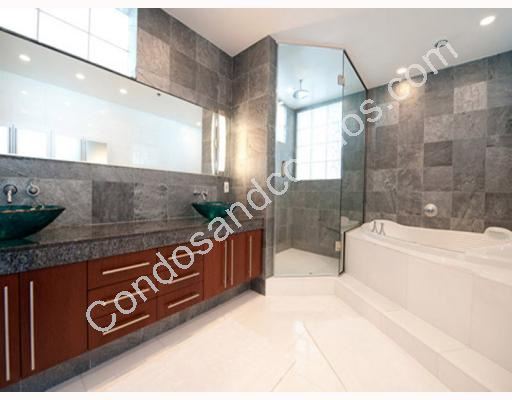 Spacious master bath with whirlpool tub and marble counters