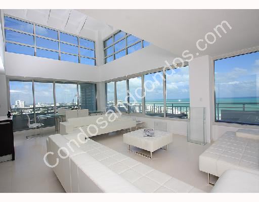 2 story living room with breath-taking ocean and city views
