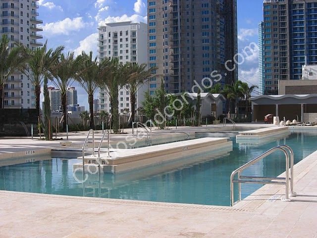 10th floor pool deck w/infinity-edge pool, tropical landscaping, daybeds & cabanas