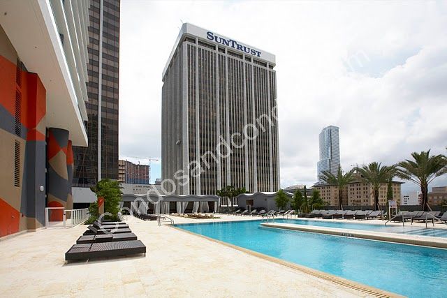 10th floor pool deck w/infinity-edge pool, tropical landscaping, daybeds & cabanas