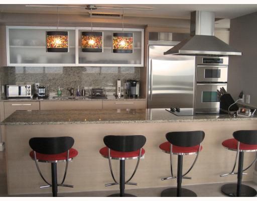 European style kitchens with KitchenAid appliances and granite countertops 