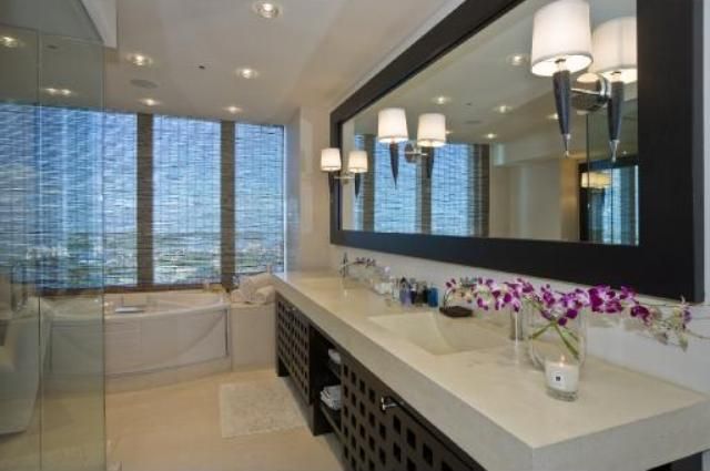His & her master baths, Whirlpool tubs & custom seamless glass enclosed showers  