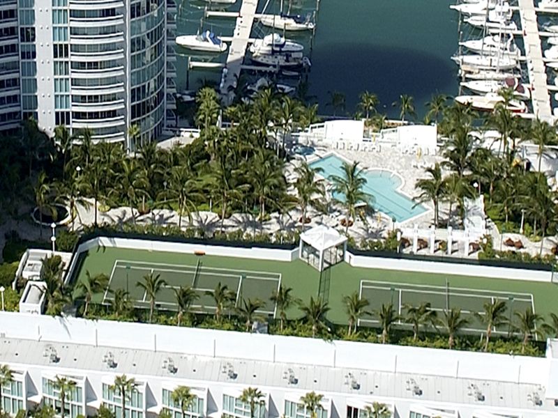 View of the two lighted Tennis Courts, Marina and Lap Pool