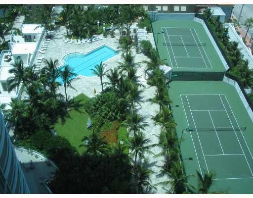 Two lighted Tennis Courts and Lap Pool