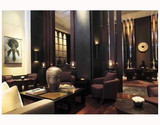Multi-level Asia-themed lobby decorated with teak, imported stone & Asian art 

