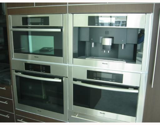 Built-in Miele oven, integrated microwave, steam oven, espresso maker & wine cooler