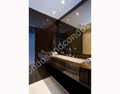 Marble vanity with vessel type sinks in bathrooms