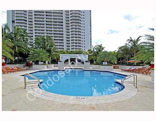 Heated pool with a pool attendant, towels, umbrellas & lounge chairs 