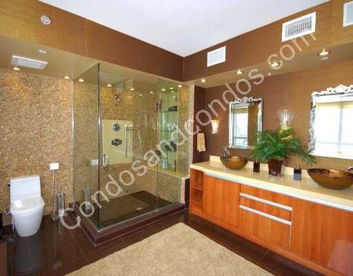 Marble flooring and seamless glass showers in master bath