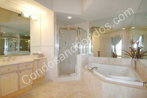 Bathrooms includes jacuzzi whirlpool tub surrounded in marble