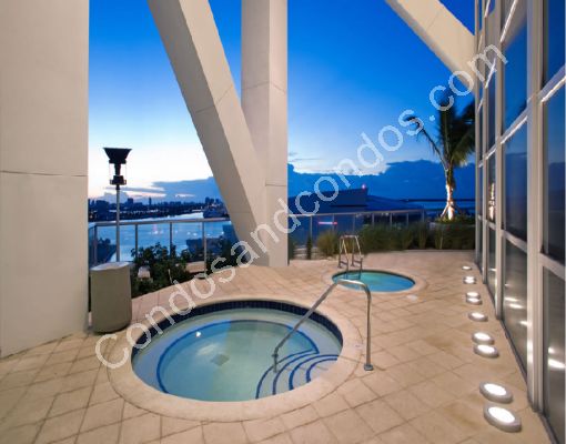 Jacuzzi with city and water-scape views