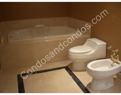 Bathroom with Chiampo Marble floors and bidet