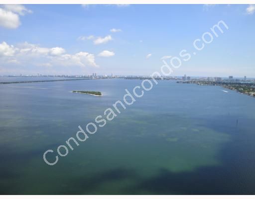 Miami vanishes between Biscayne Bay and the endless skyline