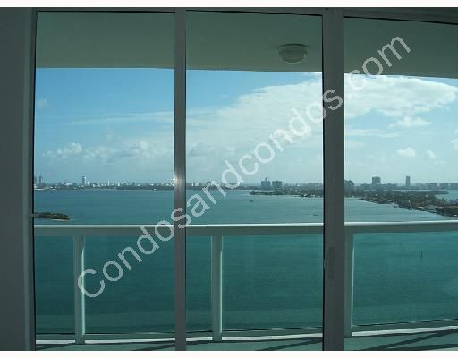 Floor-to-ceiling glass wall with Bay view