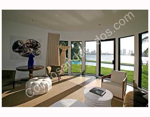 Spacious, open sitting area looks out to pool and Bay