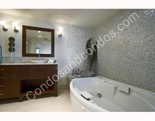 Whirlpool tub and marble-top vanity in Master Bathroom