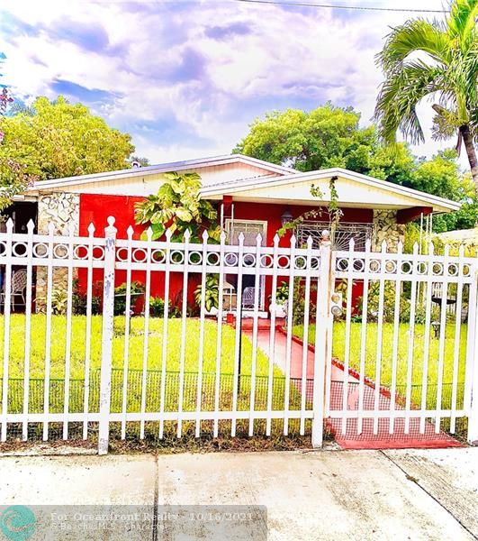 White metal fence in Front of property for privacy 3240 Thomas Ave, Miami, FL 33133
