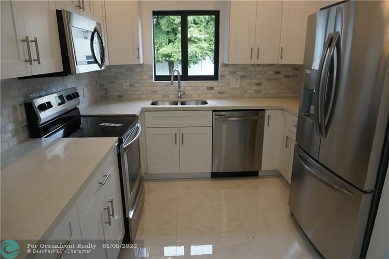 TYPICAL kitchen of builder of a previous build in Dania. New Raleigh homes to be similar.