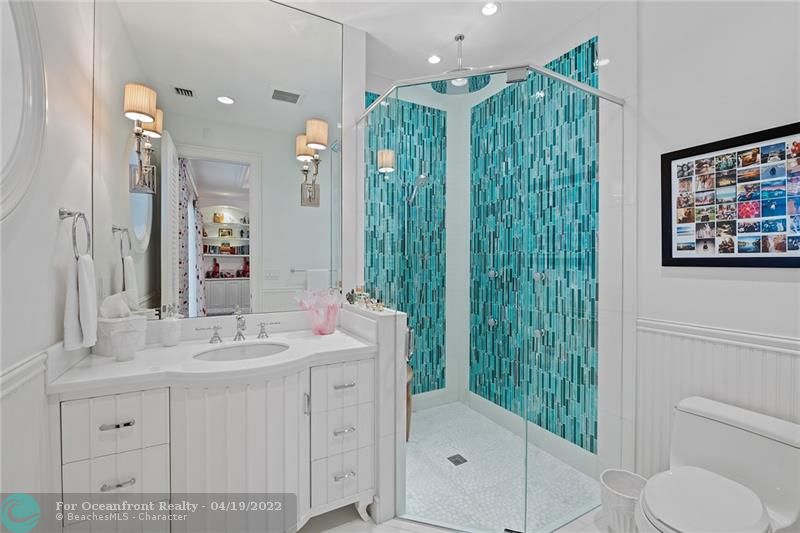 Custom built cabinet with stunning glass stone design in bathroom