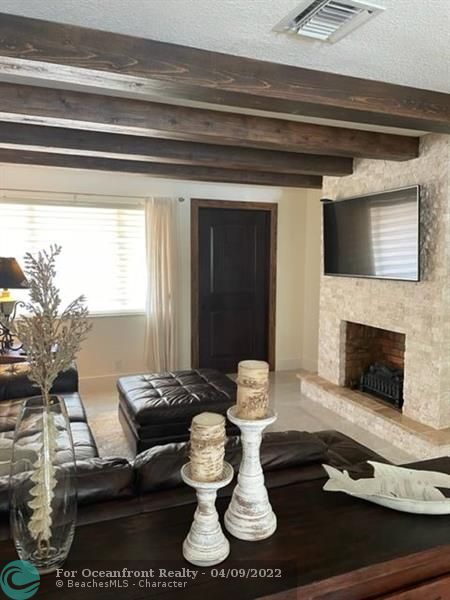 Leaving room with exposed beams