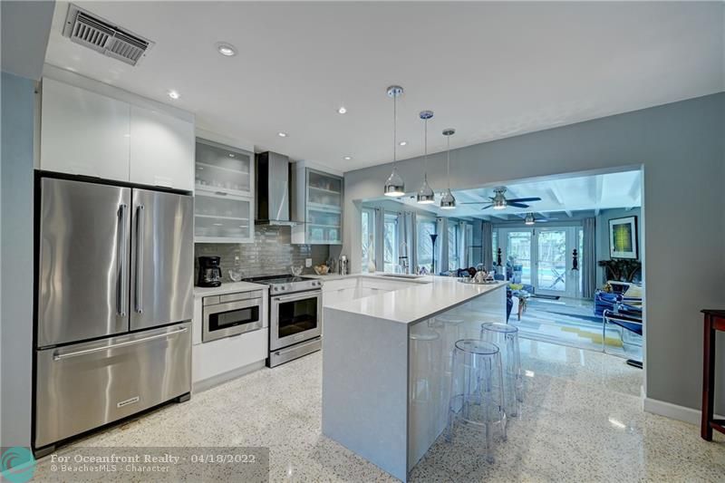 Dramatic Custom Kitchen with Waterfall Counter...