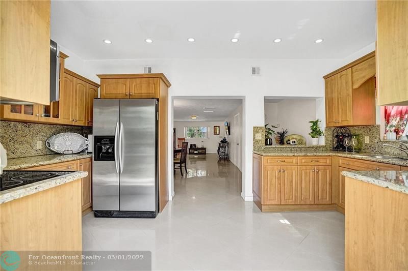 Kitchen has granite counters and stainless appliances.