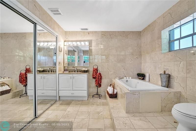 Master bathroom has the 2nd closet, jacuzzi tub and a shower.