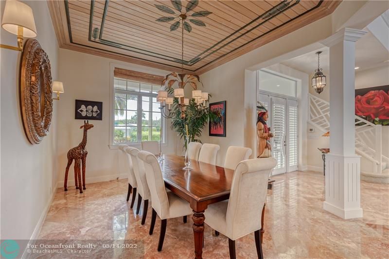 Open and spacious Formal Dining Room with custom wood ceiling