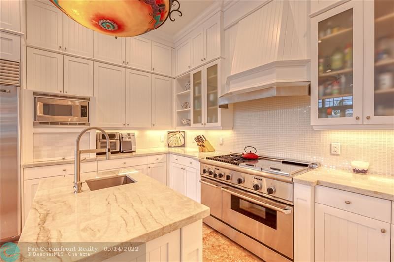 Marble center island with sink is perfect for preparing foods