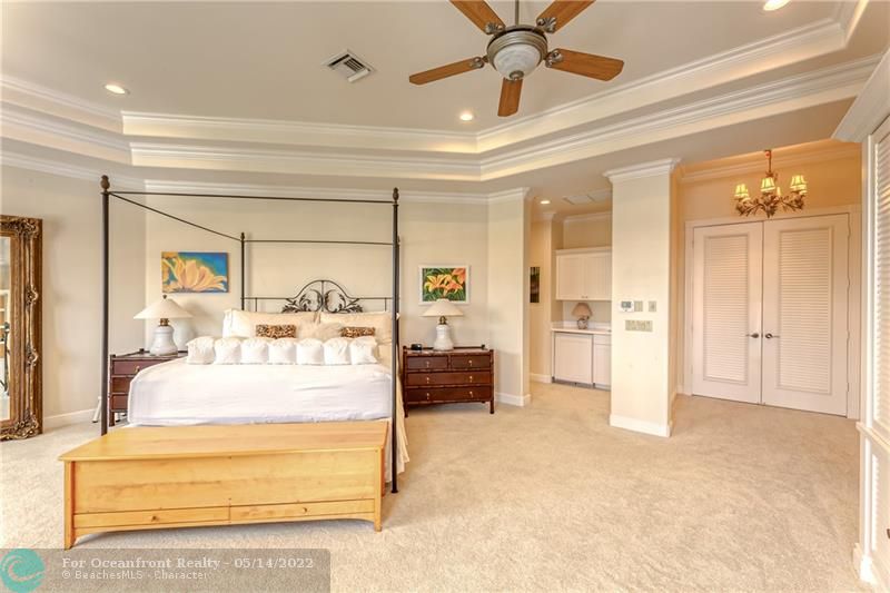 Large and spacious master bedroom with double entry doors into room