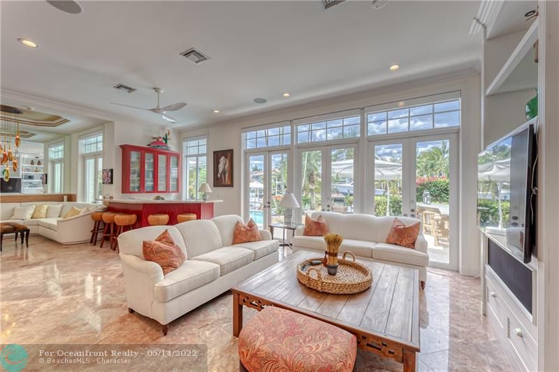 Family Room off of kitchen with floor to ceiling doors is the perfect space to relax and entertain