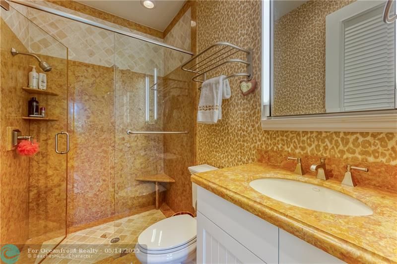 Bathroom with walk in shower with custom marble & Marble travertine