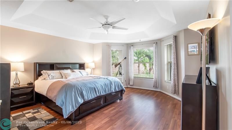 Spacious primary suite with tray ceilings on second floor