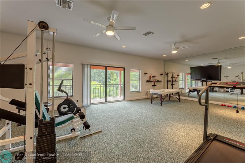 2nd Floor Gym, Flex Room with Massage Area and Sauna. Steps Out To Balcony